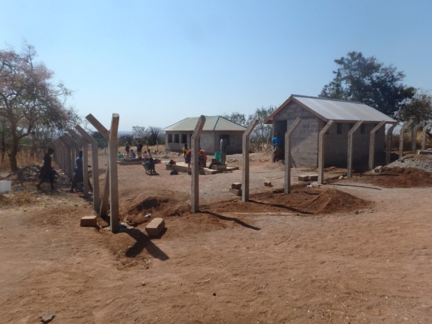The ECD plus latrine block surrounded by fence posts