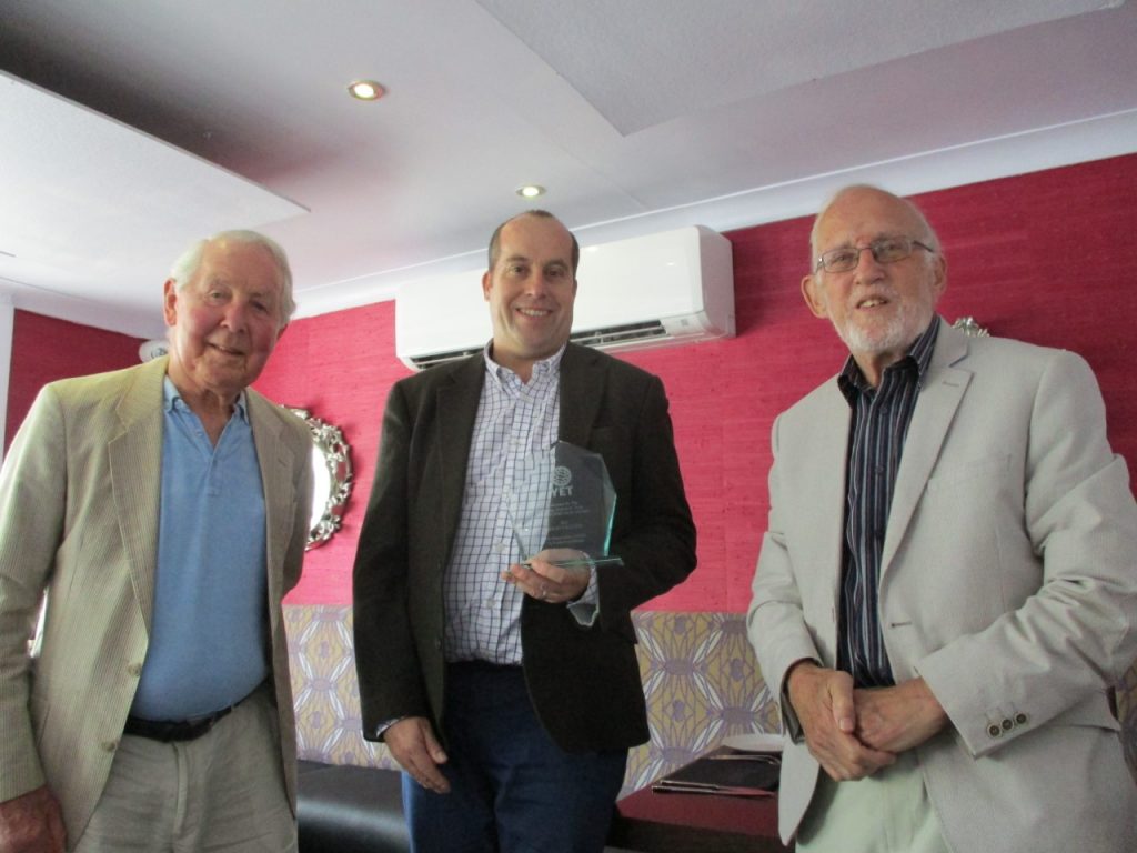 Photo of David Williams being presented with the award by Mike Cross and Ted Grey